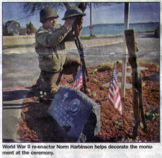 Dedication of the MIA monument, 4/29/2005.  World War II re-enactor Norm Harbinson helps decorate the monument at the ceremony. Kingston Mariner staff photo/Bert Lane.