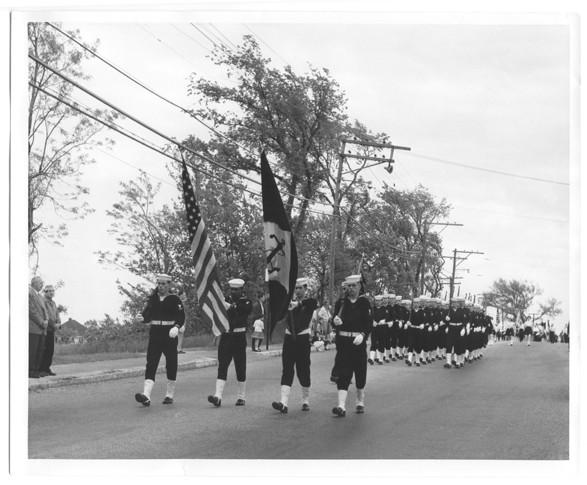 Sailors from the U.S.S. Des Moines march on Main Street